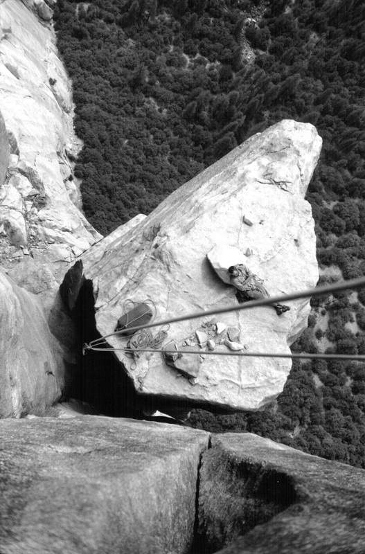 Royal Robbins relaxing on El Cap Spire during the first ascent of the Salathé Wall on El Capitan. Pitch 21, September 1961.