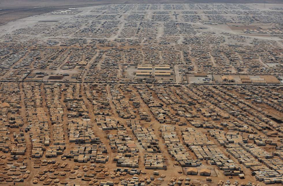 An aerial view shows the Zaatari refugee camp on July 18, 2013 near the Jordanian city of Mafraq, some 8 kilometers from the Jordanian-Syrian border. The northern Jordanian Zaatari refugee camp, now home to 160,000 Syrians, equal in size to what would be Jordan's fifth-largest city. AFP PHOTO/MANDEL NGAN/POOL (Photo credit should read MANDEL NGAN/AFP/Getty Images)